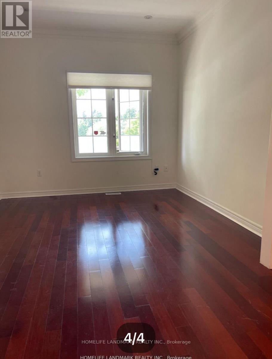 A room with wooden floors and a window.