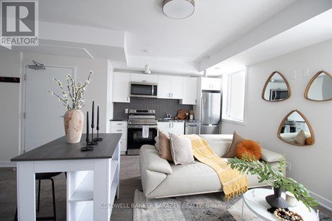A modern living room with a white couch and a coffee table.