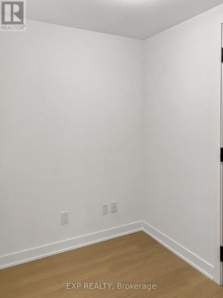 A room with white walls and wooden flooring.