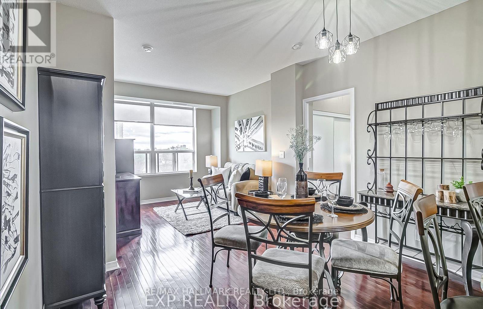 A dining room with a table set for four.