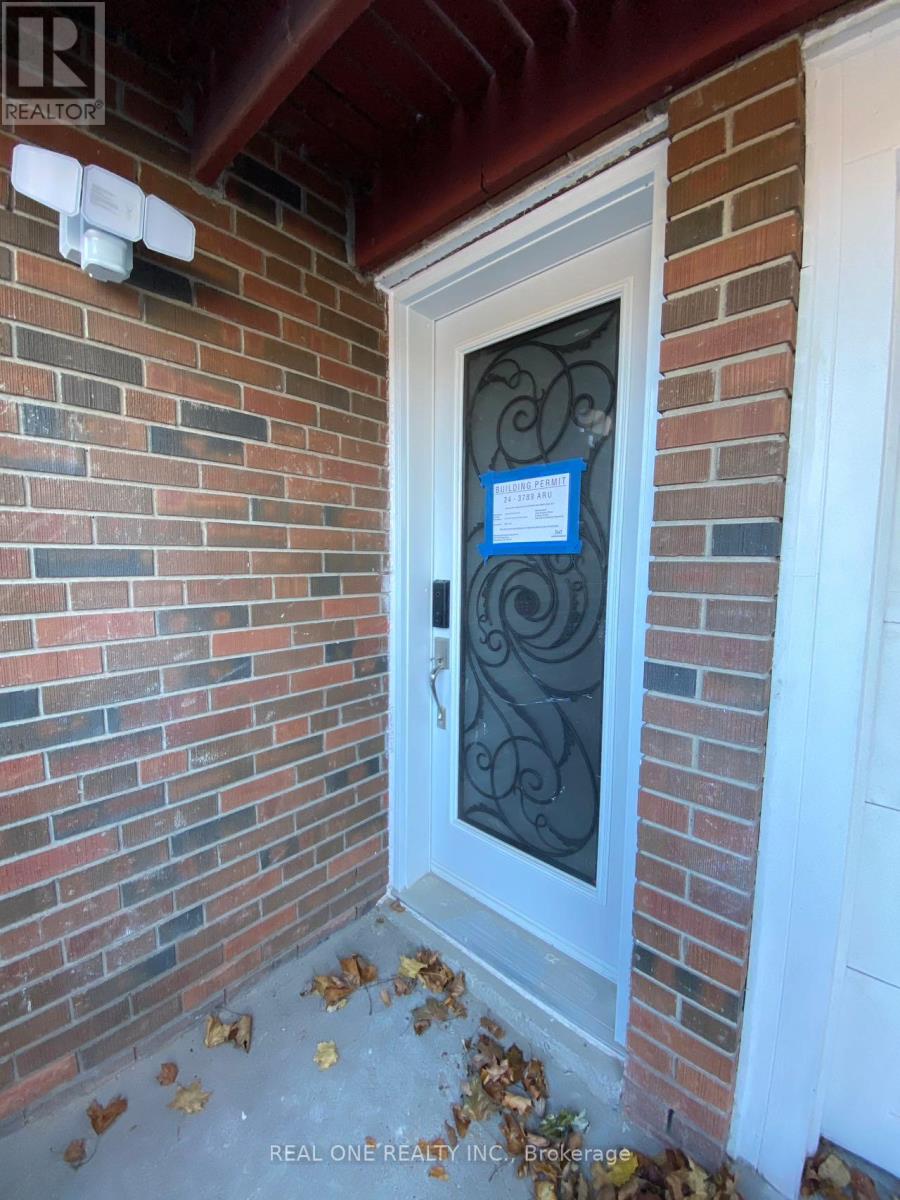 A door with a glass window and a sign on it.
