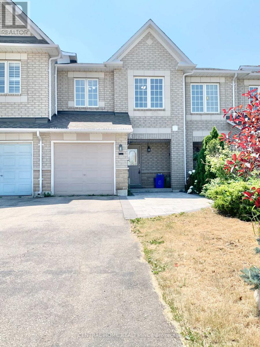 A large house with a garage and a driveway.