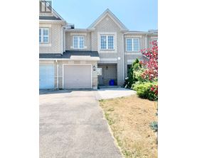 A large house with a garage and a driveway.