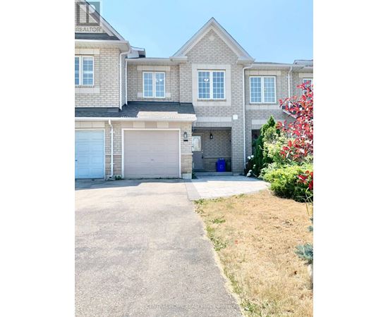 A large house with a garage and a driveway.