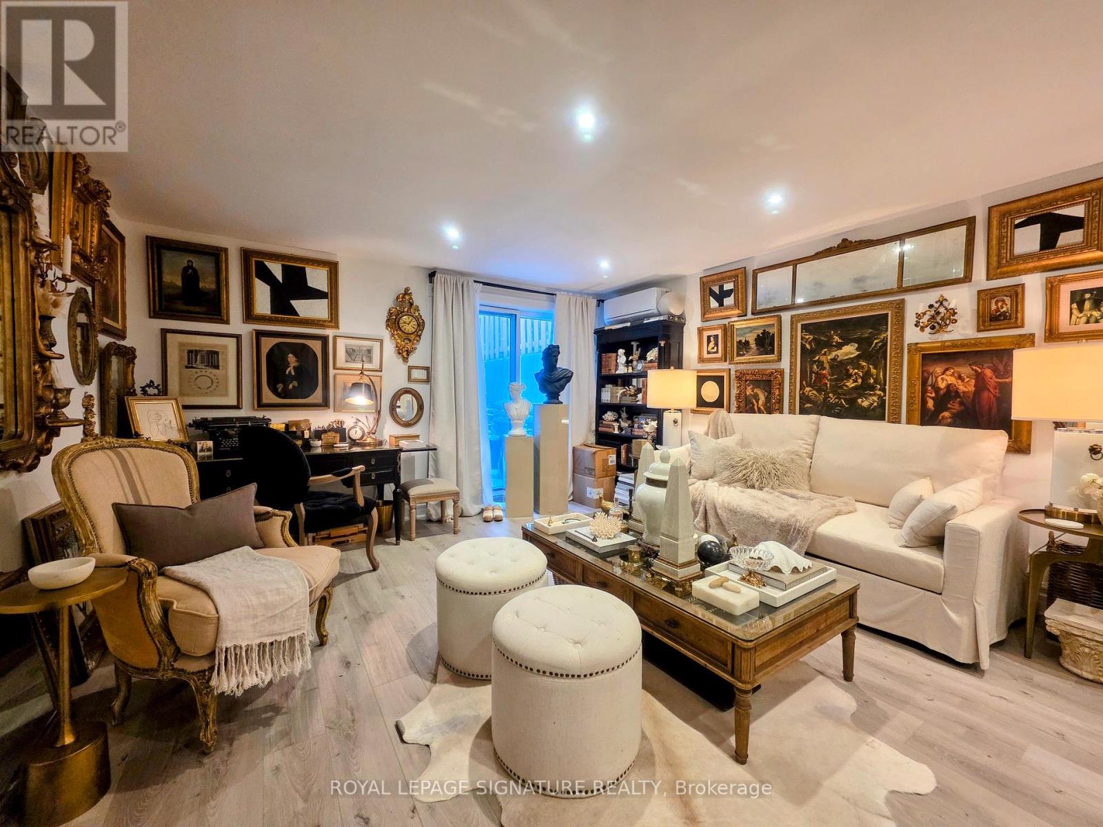 A well-furnished living room with a piano and a large window.