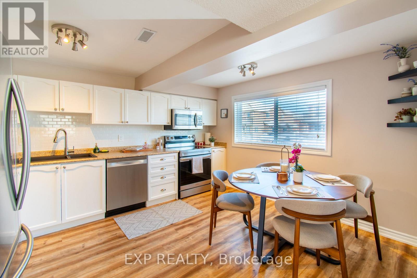 A kitchen with a dining table set for two.