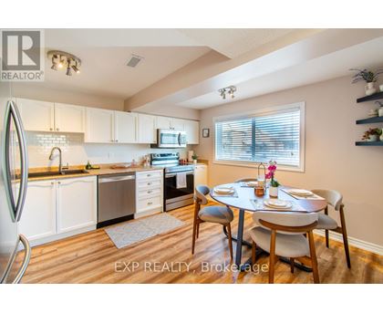 A kitchen with a dining table set for two.