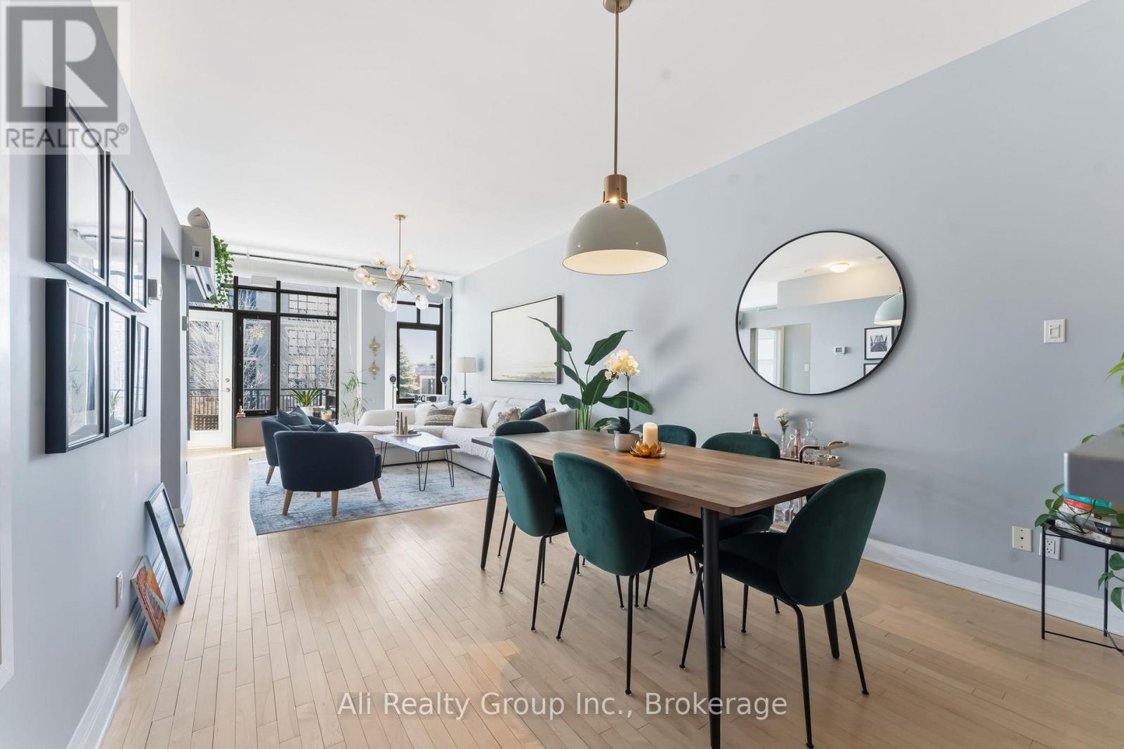 A dining room with a table set for four.