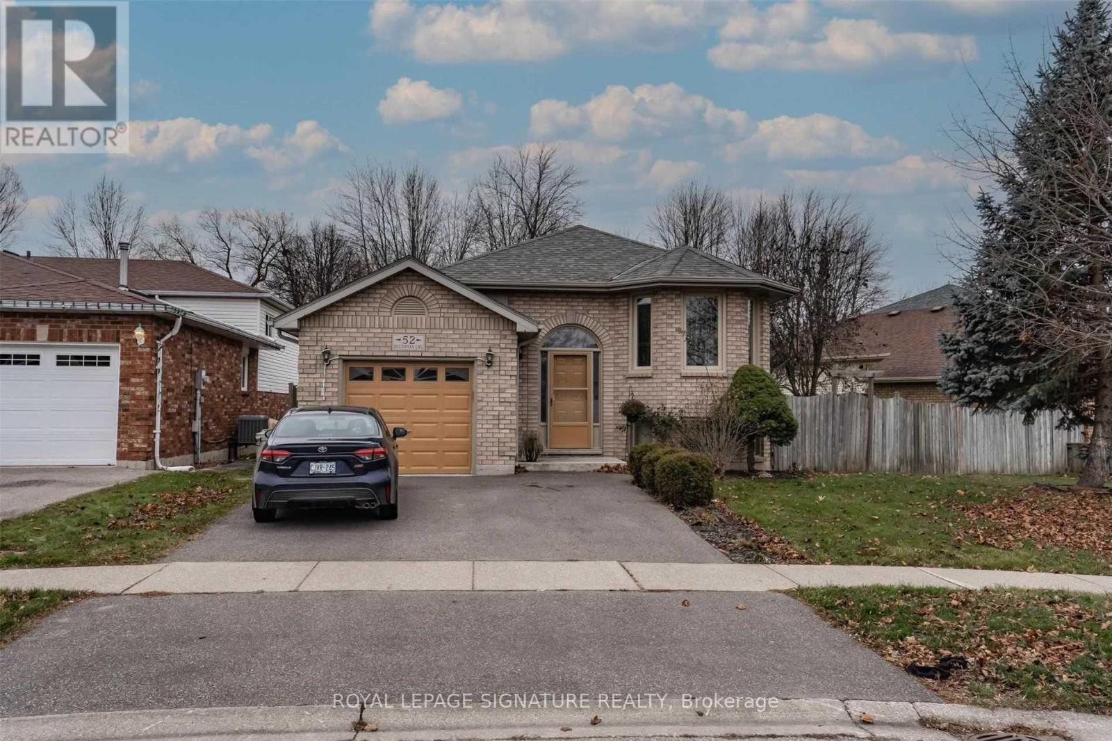 A car is parked in front of a house with a Royal LePage Signature Realty logo.