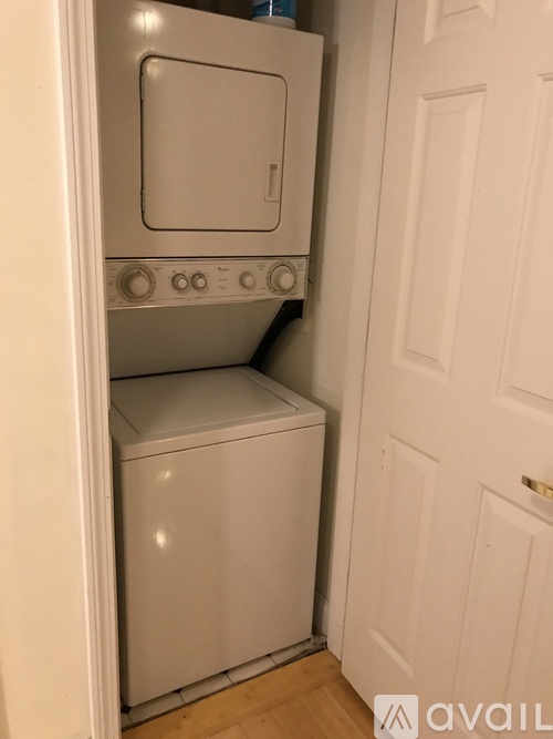 A white oven and dishwasher in a small kitchen.