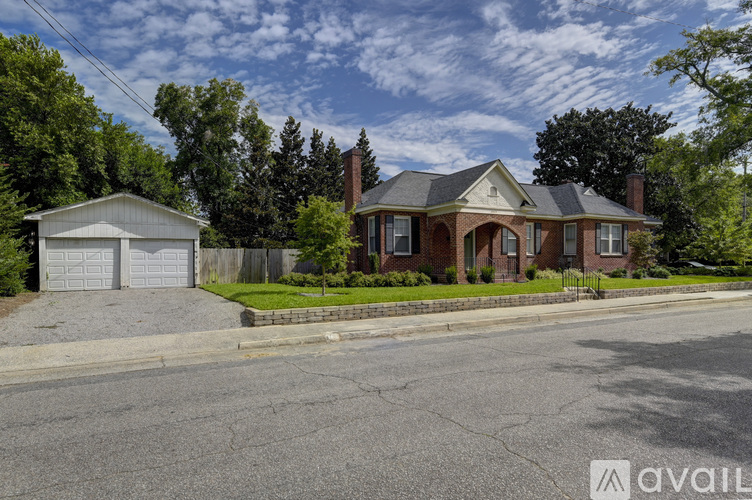 A house with a driveway in front of it.