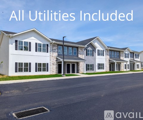 A row of houses with the text "All Utilities Included" displayed.