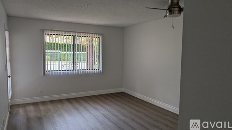 A room with a white door and a glass door.