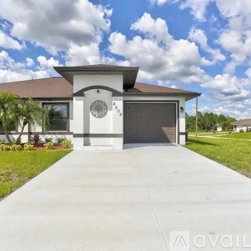 A house with a driveway in front of it.