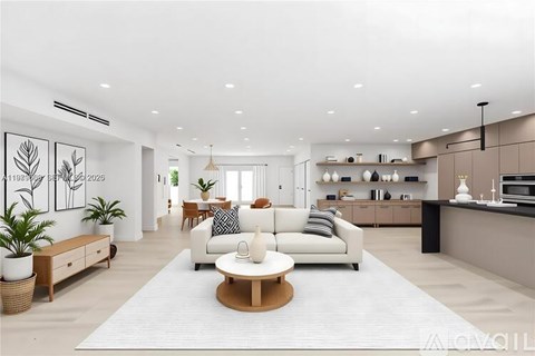 A modern living room with a white sofa set and a wooden coffee table.