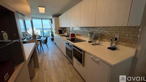 A modern kitchen with wooden cabinets and a large island.