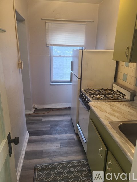 A kitchen with a sink and a window.