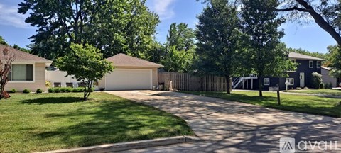A residential area with a house and a driveway.