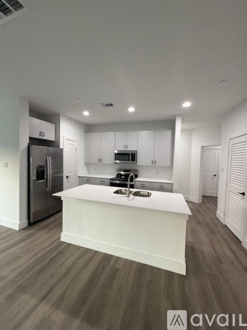 A modern kitchen with a large island in the middle.