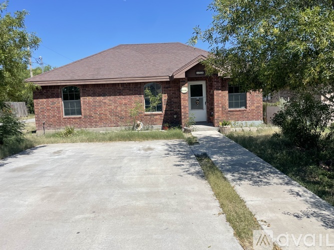 A house with a driveway in front of it.