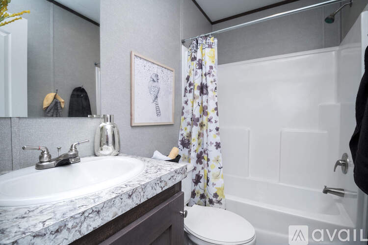 A bathroom with a marble countertop and a white toilet.