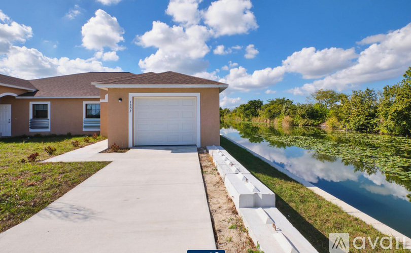 A house with a driveway leading to a garage.