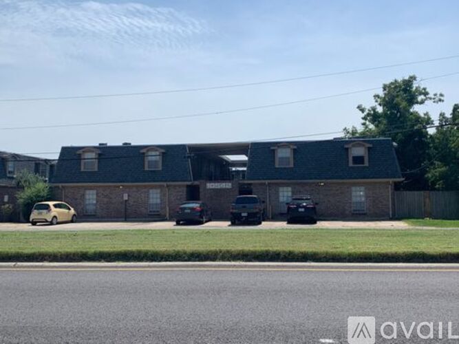 A house with a car parked in front of it.