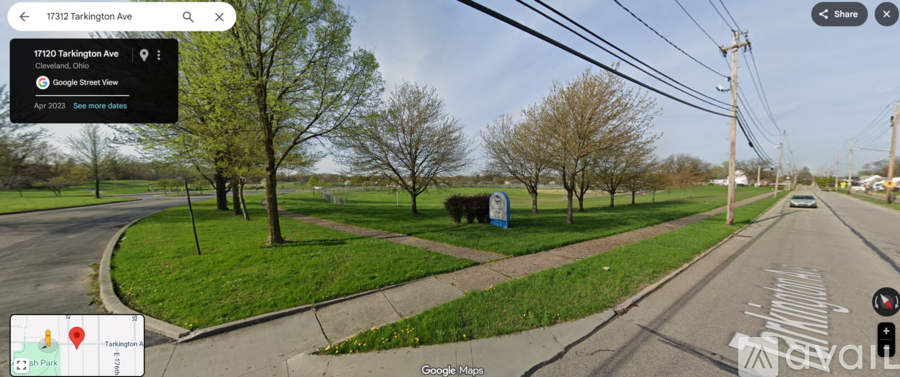 A street view of T3703 Tarkington Ave with a green grassy area on the left.