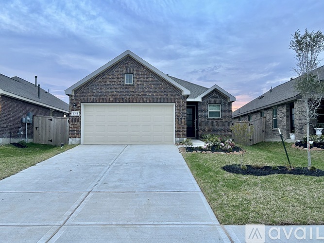 A house with a garage is for sale.