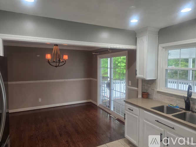 A kitchen with a sink and a window.