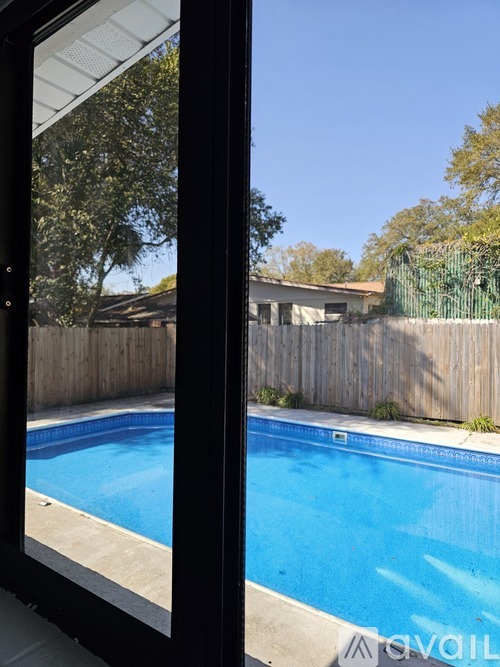 A pool seen through a window.