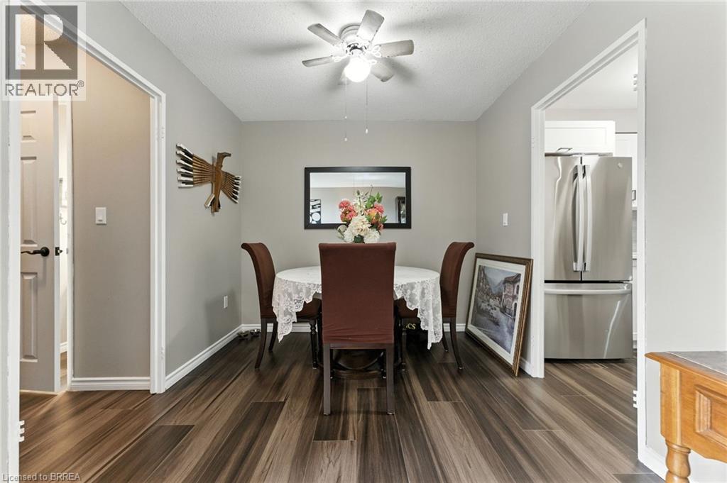 A dining room with a table set for four.