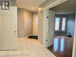 A room with a white door and a window.