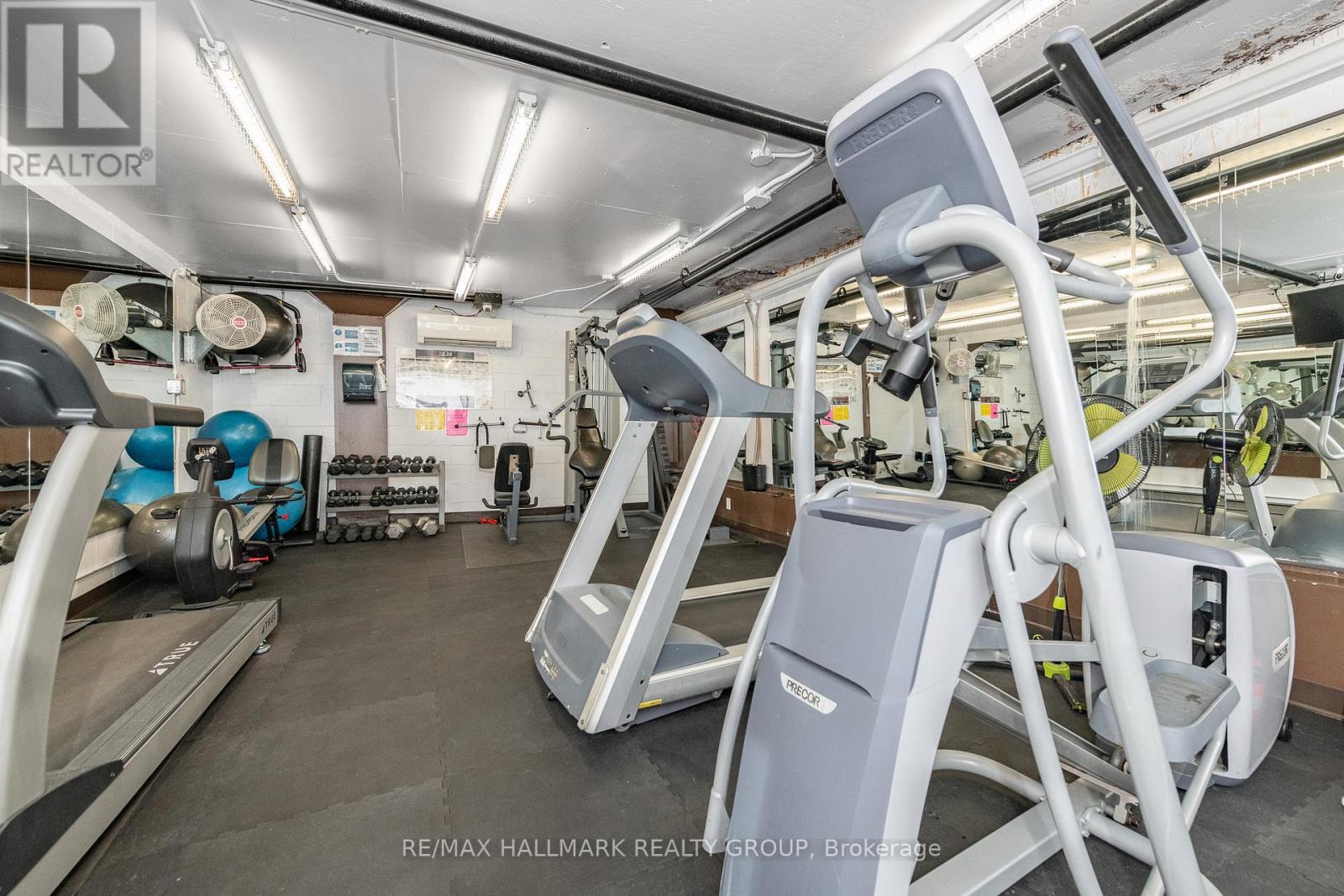 A gym with treadmills and exercise equipment.