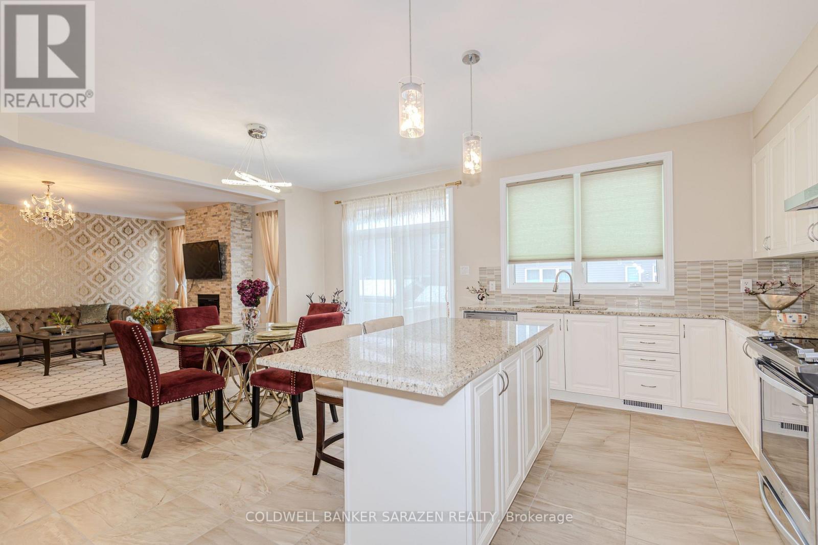 A well-lit kitchen with a dining table set for four.