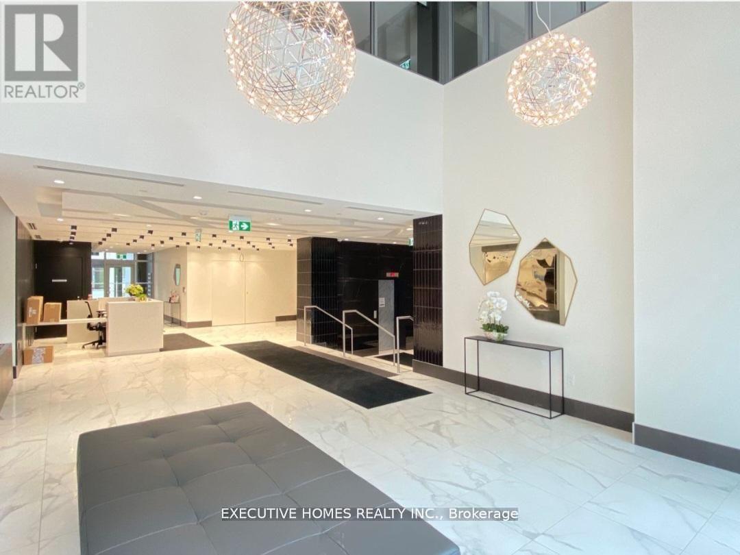 A modern office space with a reception area and a large mirror on the wall.
