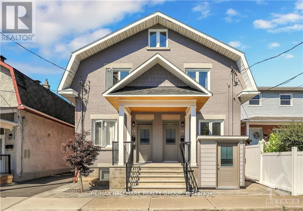 A house with a front yard and a white fence is for sale.