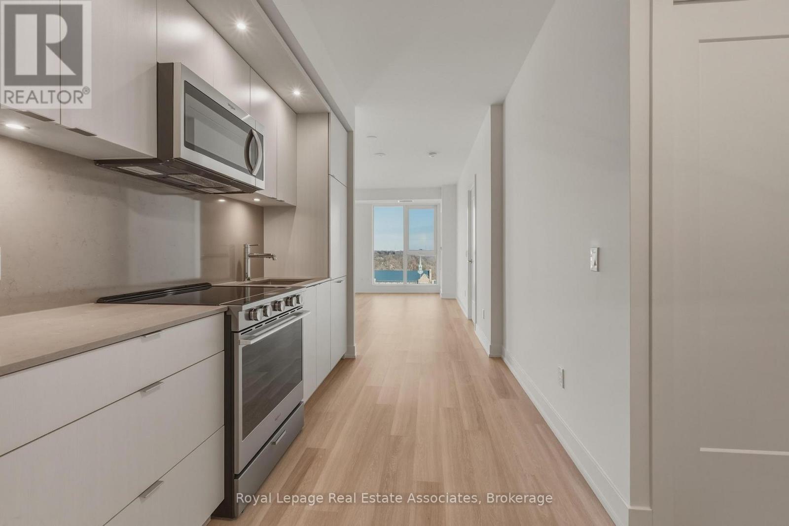 A modern kitchen with a microwave above the stove.