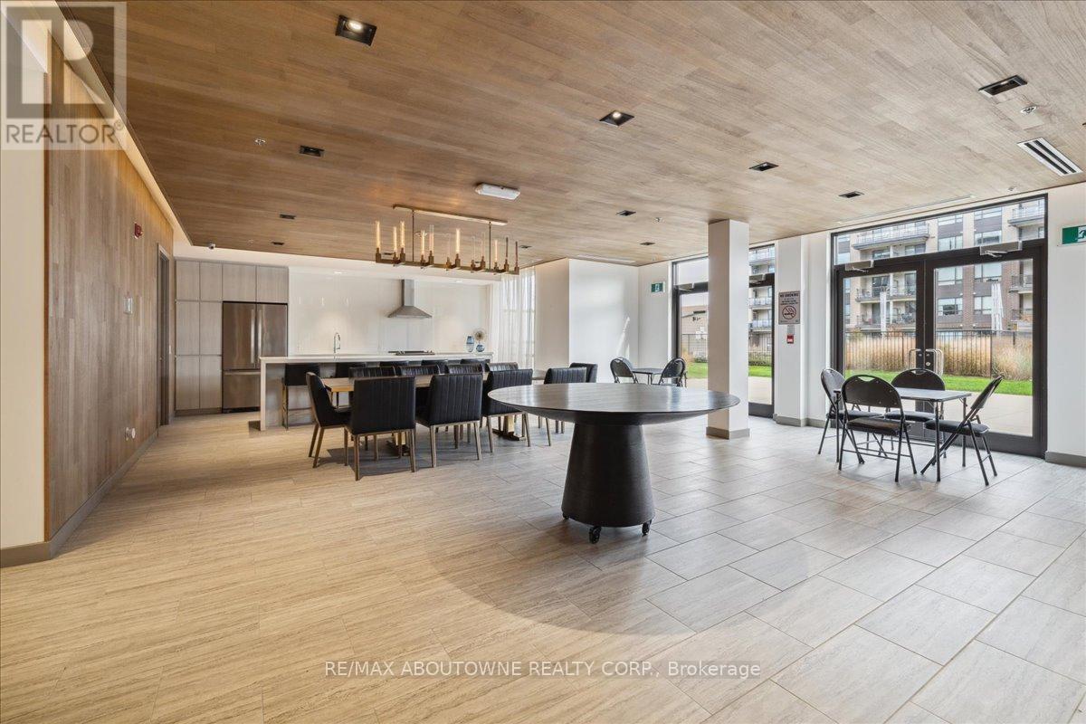 A modern dining room with a large table and chairs.