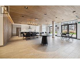 A modern dining room with a large table and chairs.