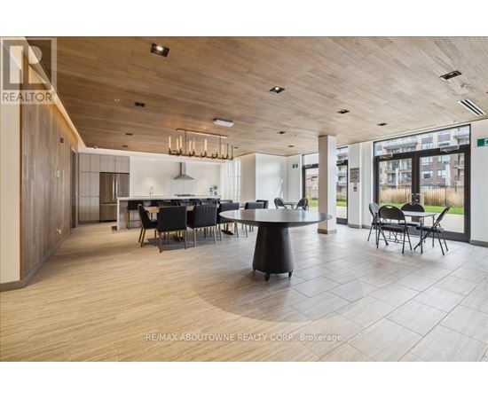 A modern dining room with a large table and chairs.