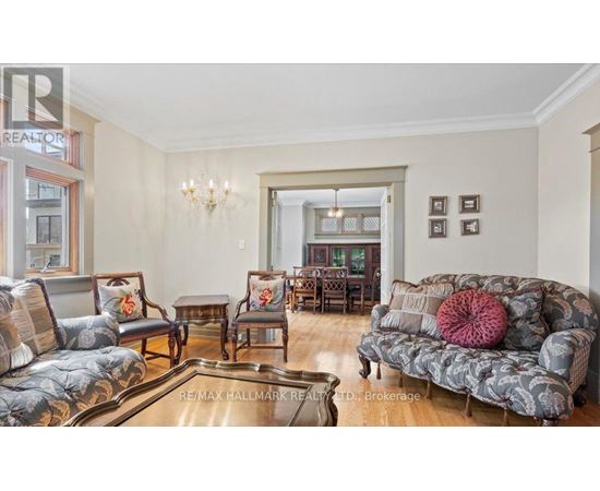 A living room with a grey sofa and a coffee table.