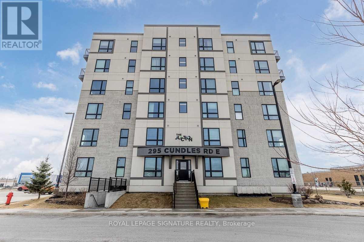 A building with the sign "295 Cundles Rd E" is shown in the image.