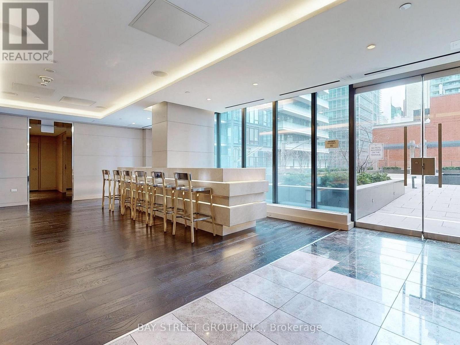 A spacious office with a long table and chairs is available for rent.