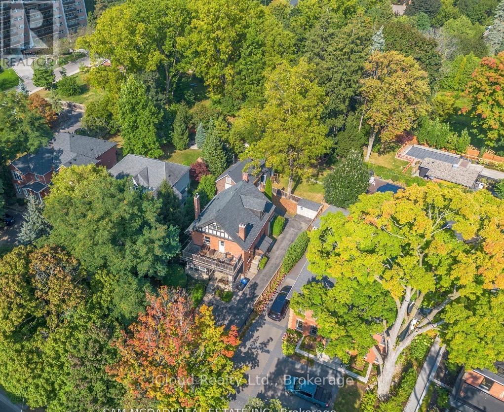 A bird's eye view of a residential area with houses and trees.