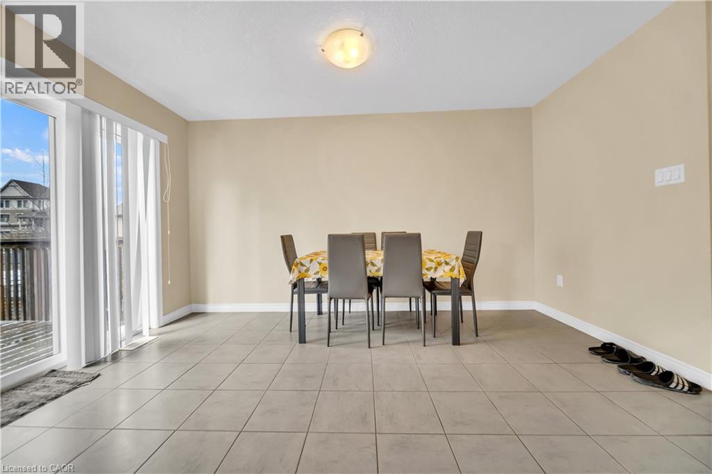A dining room with a table set for four.