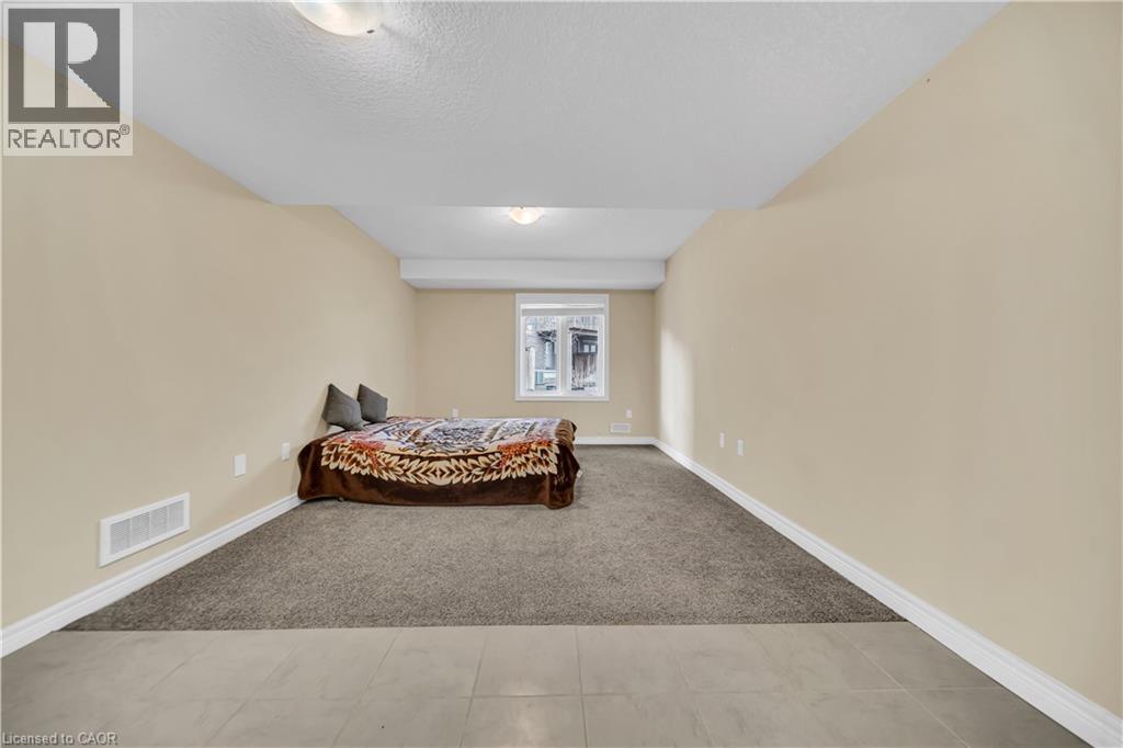 A bedroom with a bed and a window.