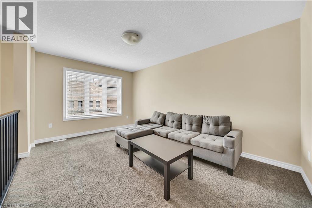 A living room with a grey sofa and a coffee table.