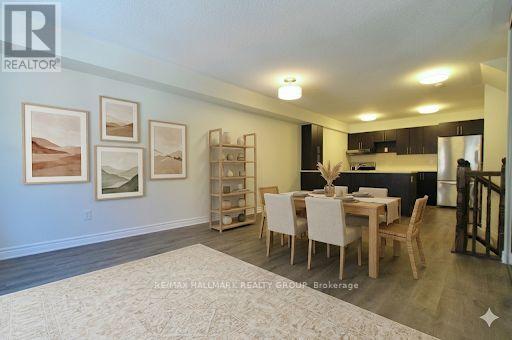 A dining room with a table set for four.