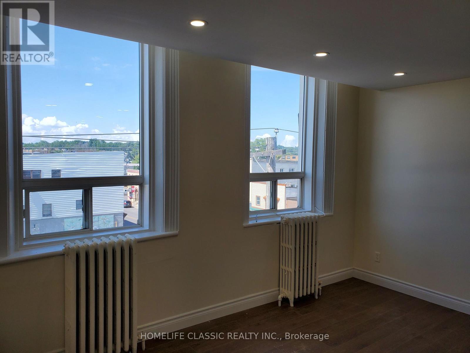A room with a window and a radiator.